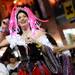 A member of the Krewe of Augstina smiles as she tosses beads to the crowd during the Outback Bowl New Year's eve parade in Ybor City, Fla. on Monday night. Melanie Maxwell I AnnArbor.com